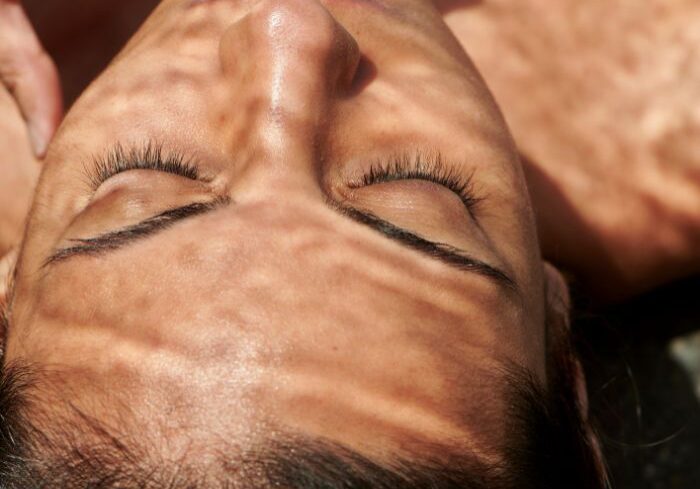 woman's face with tinted lashes and brows