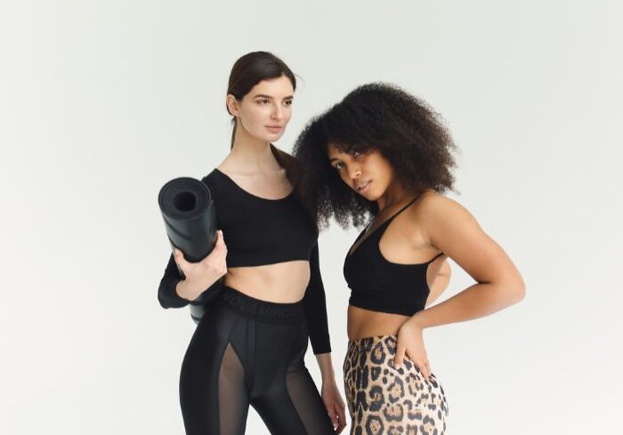 women holding yoga mat